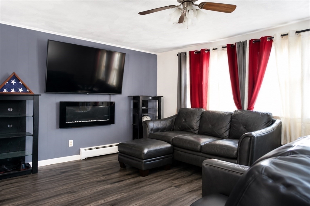 18 Ralston Road Boston, MA 02136 - Photo 6 of 26 a living room with furniture and a flat screen tv