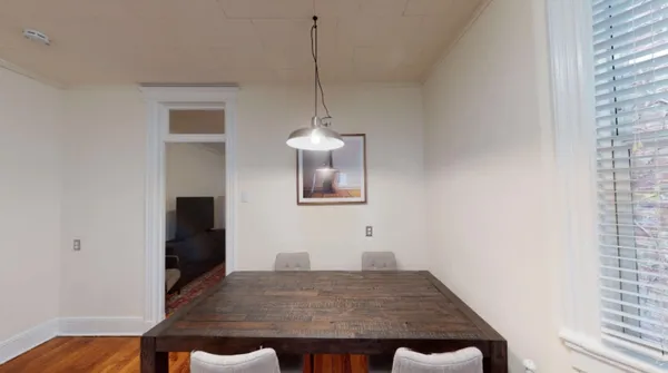 a view of a dining room with a wooden floor