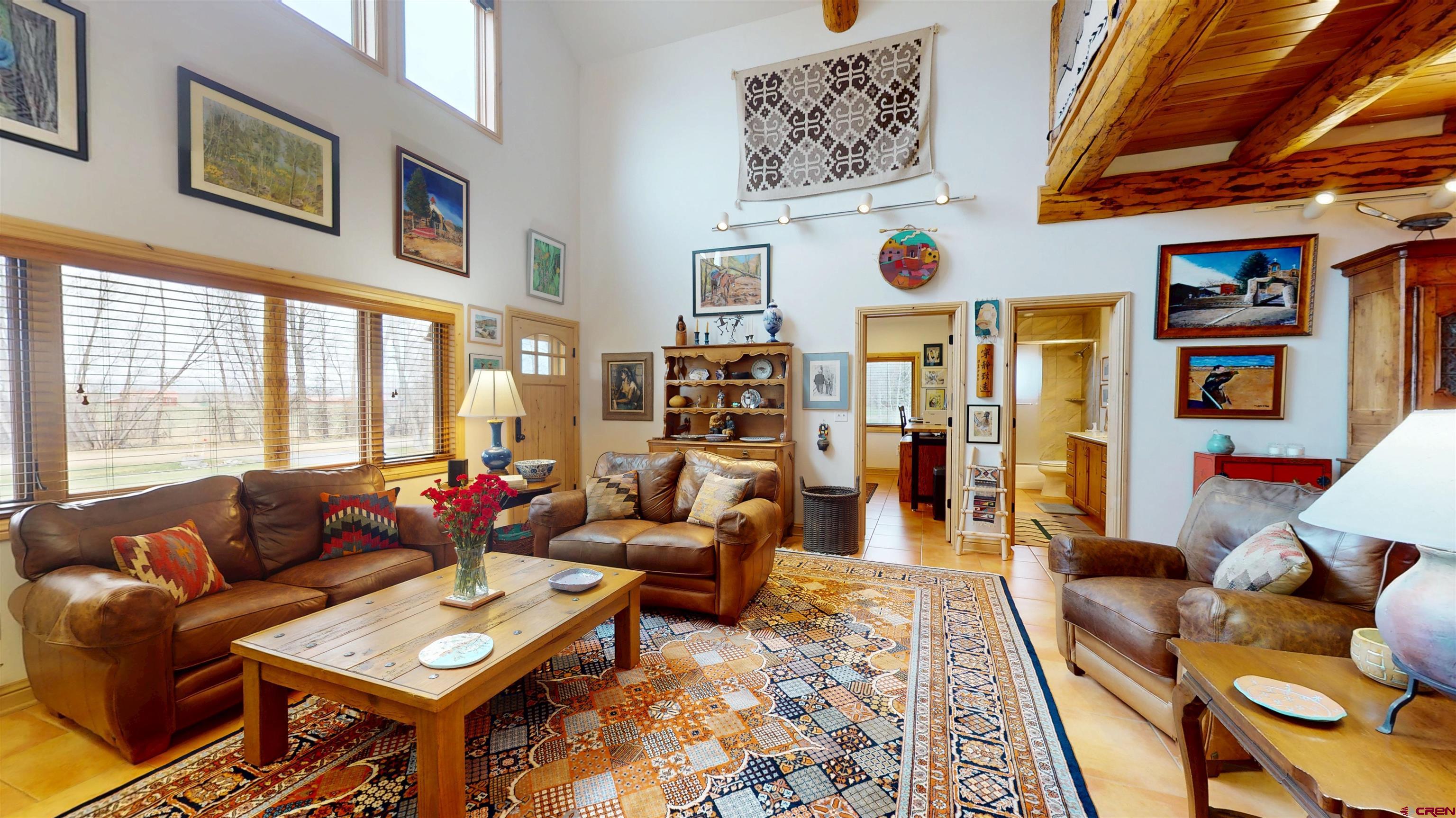 157 Spring Meadow Trail Gunnison, CO 81230 - Photo 14 of 43 a living room with furniture and a large window