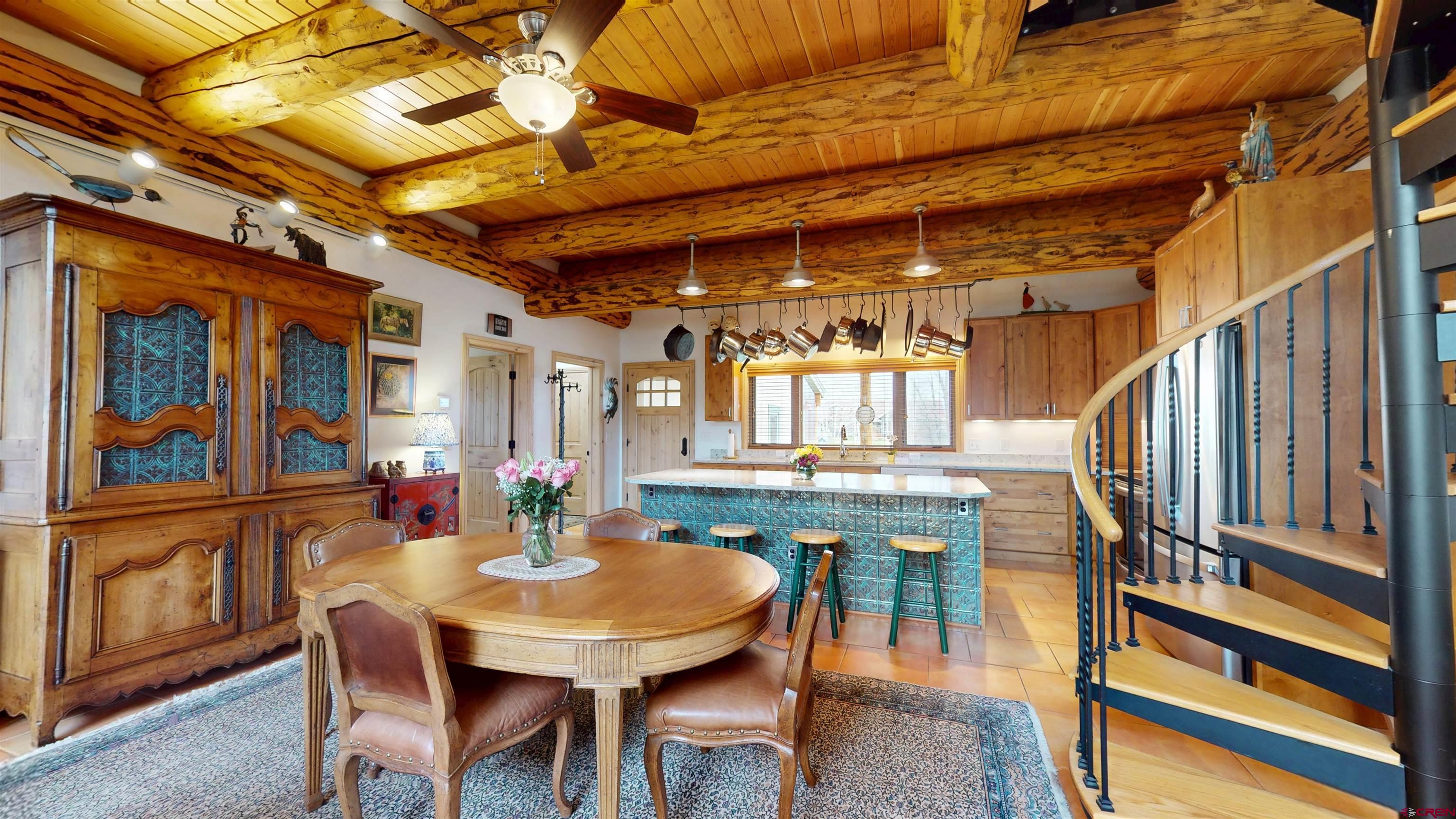 157 Spring Meadow Trail Gunnison, CO 81230 - Photo 19 of 43 a view of a dining room with furniture window and wooden floor