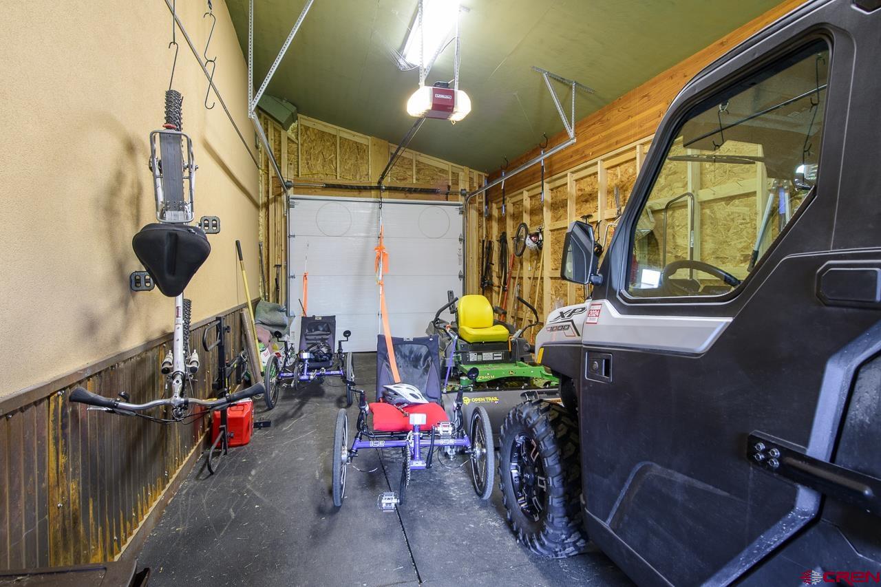 157 Spring Meadow Trail Gunnison, CO 81230 - Photo 27 of 43 Attached to North side of the garage and entry from the garage with roller door and access door to the East. Storage for garden equipment and outdoor toys. Shed is not heated but has lights.