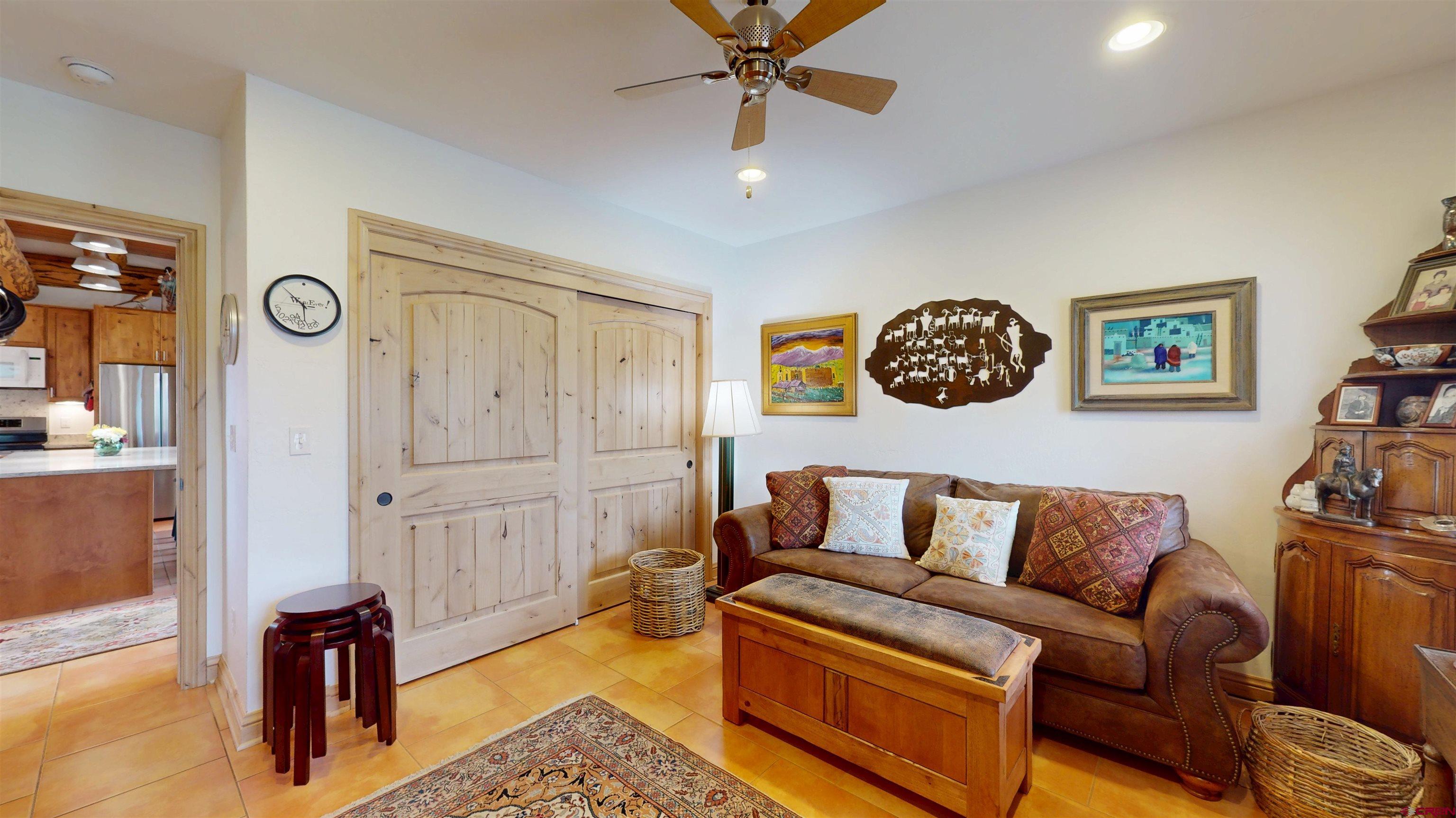 157 Spring Meadow Trail Gunnison, CO 81230 - Photo 29 of 43 a living room with furniture and a lamp