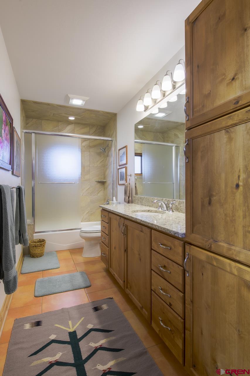 157 Spring Meadow Trail Gunnison, CO 81230 - Photo 30 of 43 a bathroom with a sink and a mirror
