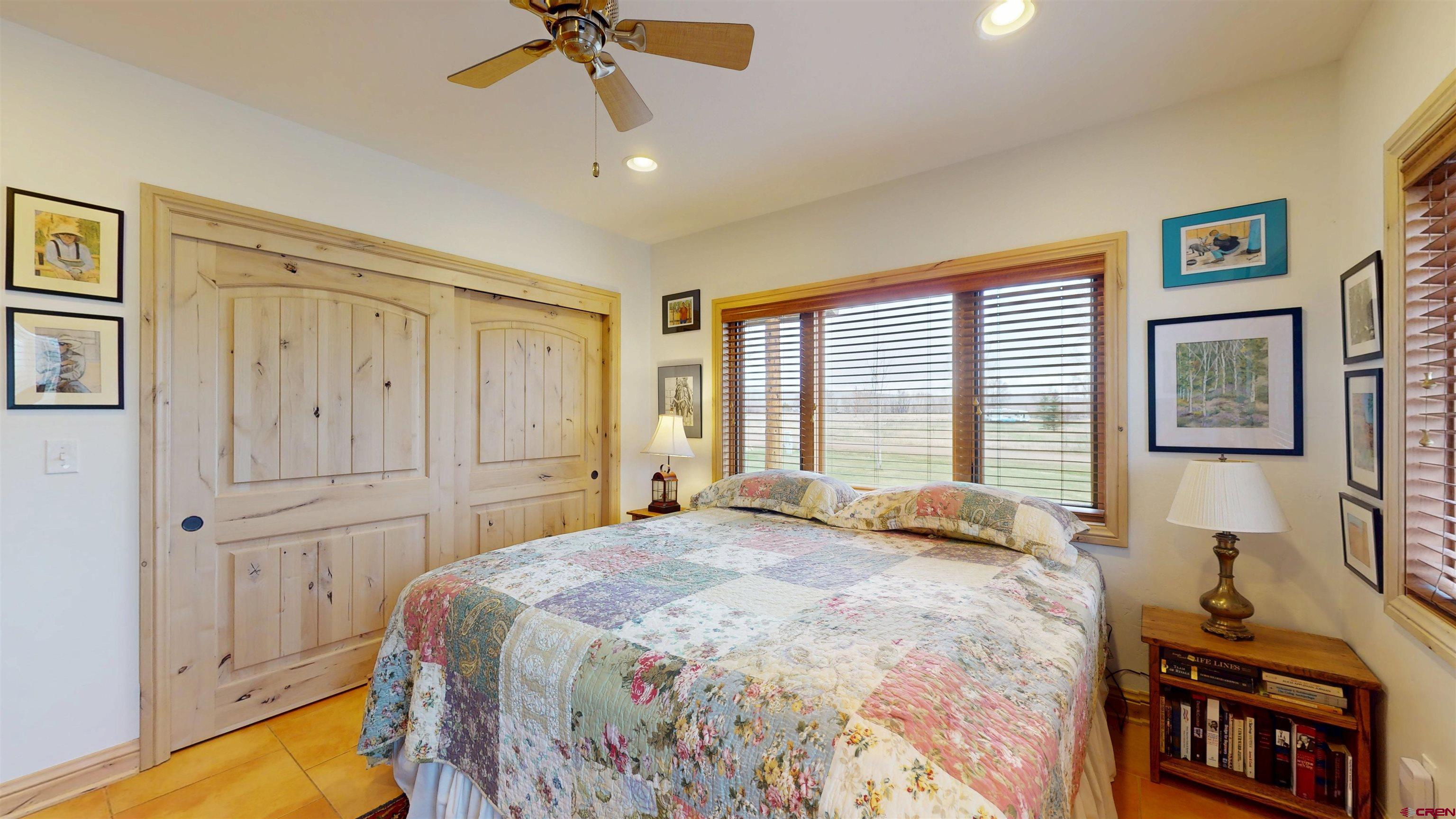 157 Spring Meadow Trail Gunnison, CO 81230 - Photo 32 of 43 a bedroom with a bed dresser and a window