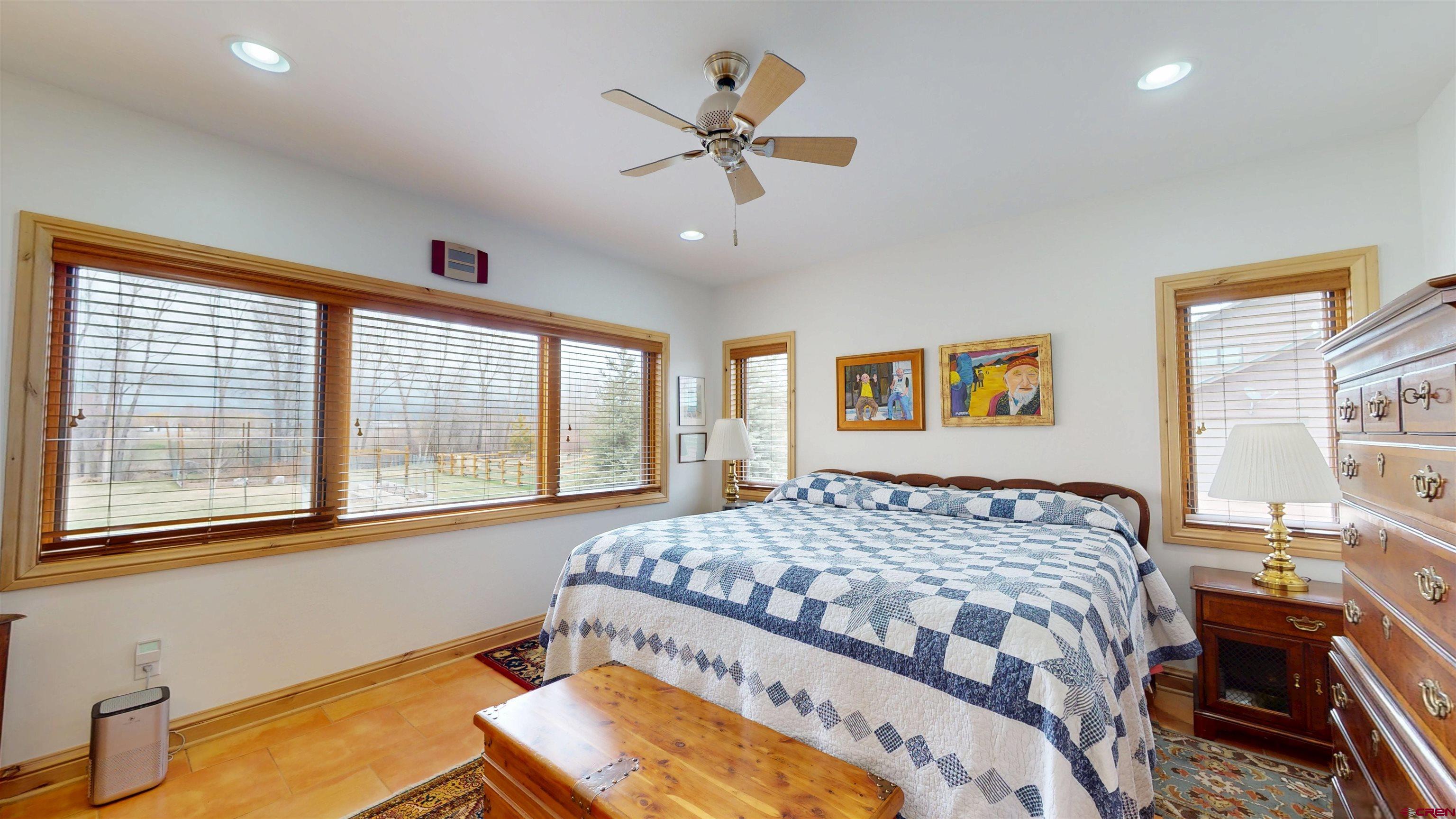 157 Spring Meadow Trail Gunnison, CO 81230 - Photo 33 of 43 a bedroom with a bed and window