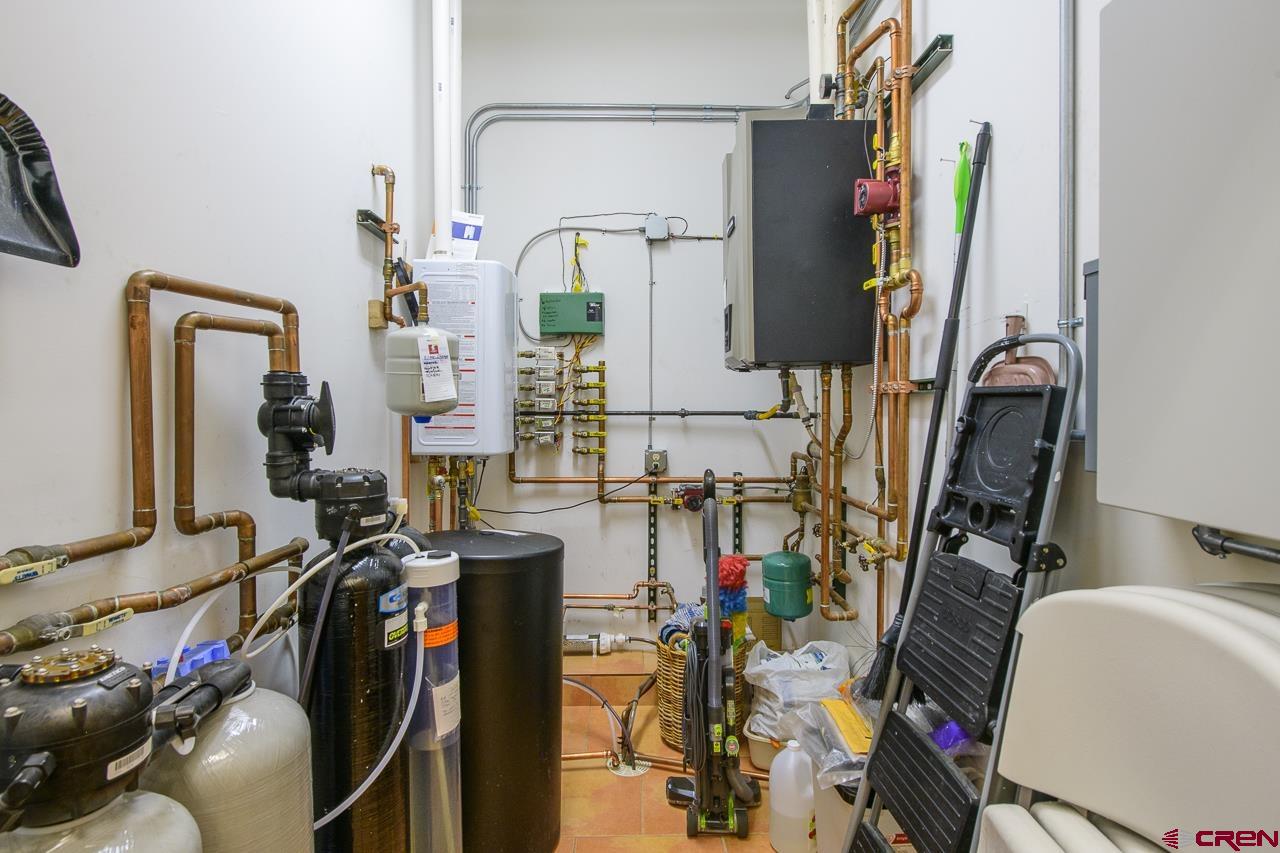 157 Spring Meadow Trail Gunnison, CO 81230 - Photo 43 of 43 a view of walk in closet with clothes and shoes