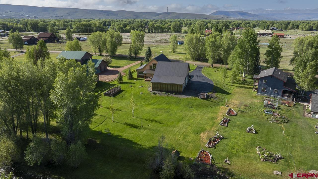 157 Spring Meadow Trail Gunnison, CO 81230 - Photo 7 of 43 an aerial view of lake residential house with outdoor space and trees all around