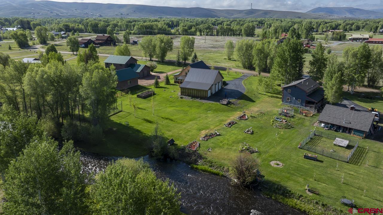 157 Spring Meadow Trail Gunnison, CO 81230 - Photo 8 of 43 an aerial view of a house with garden