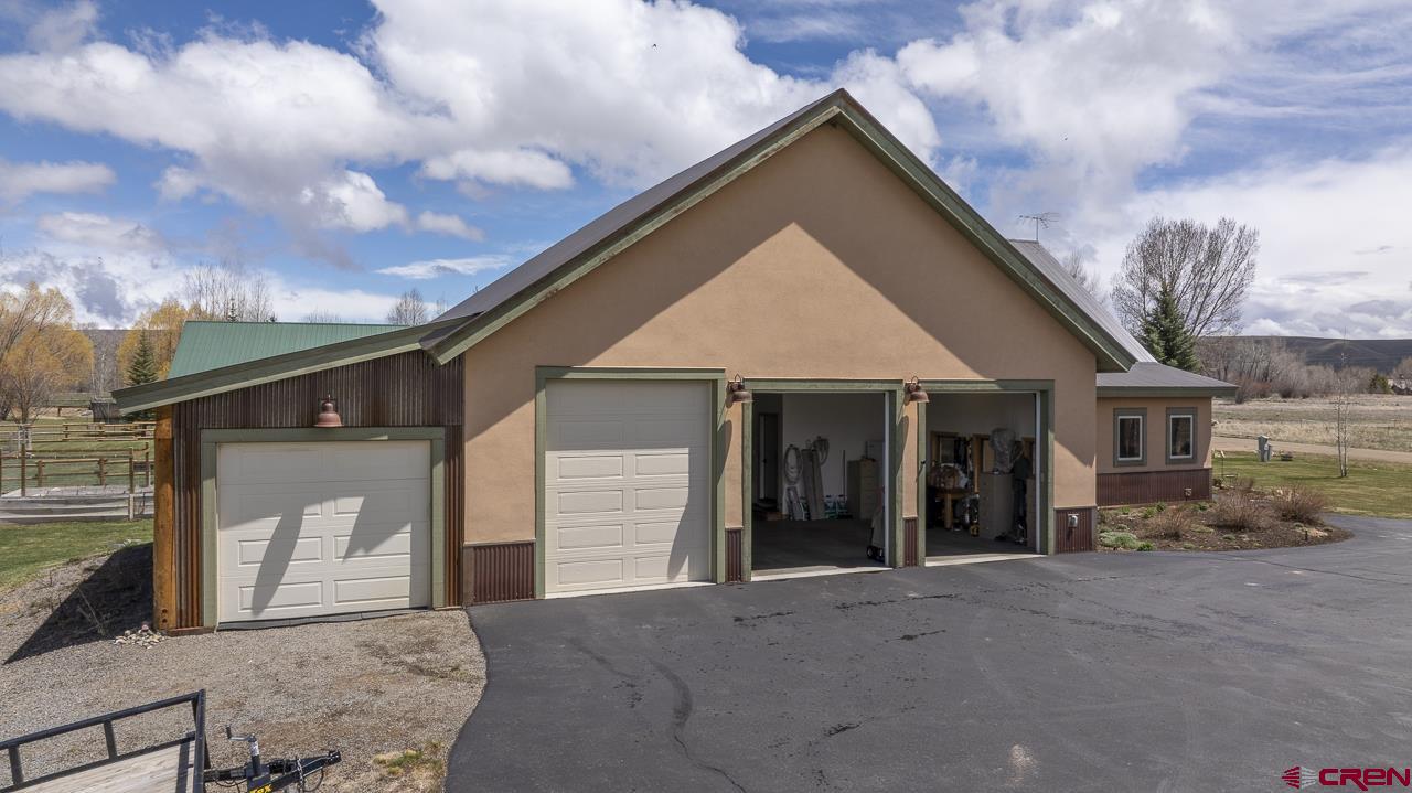 157 Spring Meadow Trail Gunnison, CO 81230 - Photo 9 of 43 a front view of a house with a yard