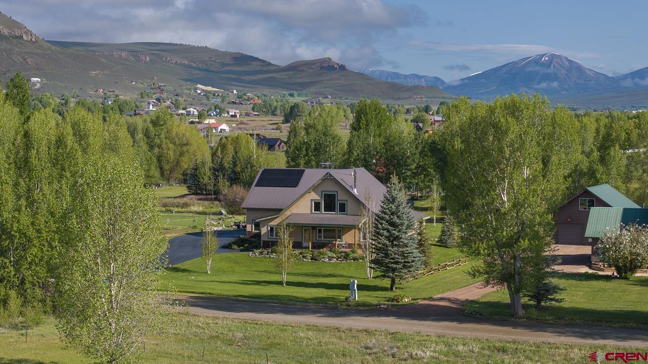 157 Spring Meadow Trail Gunnison, CO 81230 - Photo 10 of 43 a view of a garden with a houses