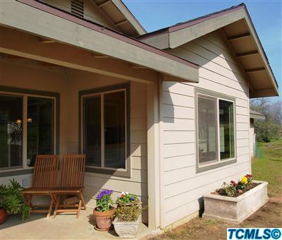 40131 Pierce Drive Three Rivers, CA 93271 - Photo 2 of 25 a view of a porch with a dining table and chairs potted plants