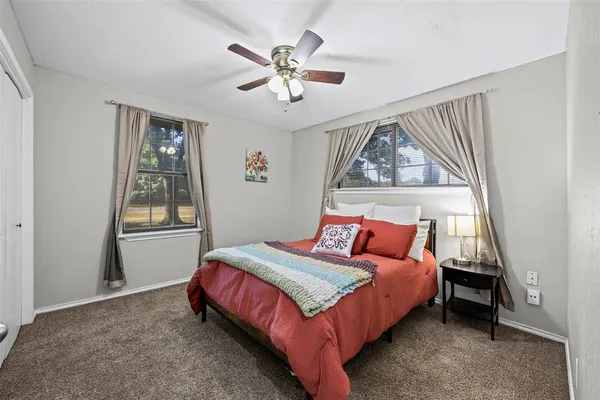 a bedroom with a bed and window