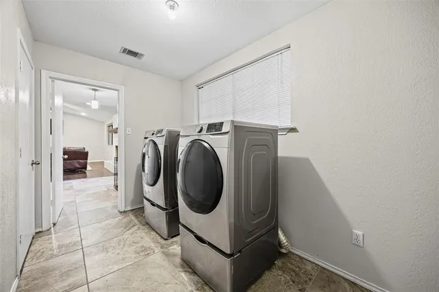 a utility room with dryer and washer