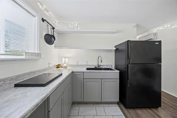 a kitchen with a sink a refrigerator and a sink