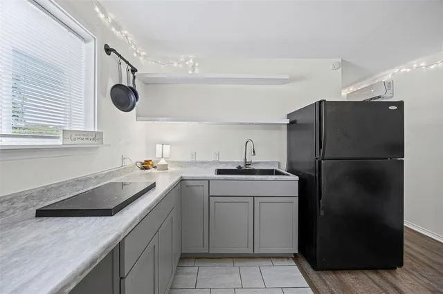 a kitchen with a sink a refrigerator and a sink