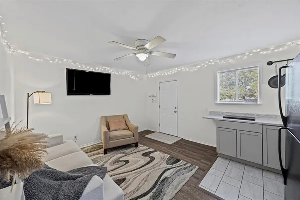 a bedroom with furniture and a flat screen tv