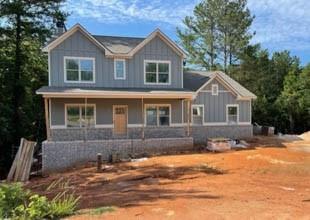 2148 Hope Lane Monroe, GA 30656 - Photo 1 of 1 a front view of a house with a yard
