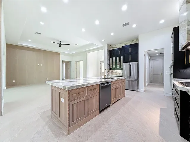 an empty room with a empty space and windows