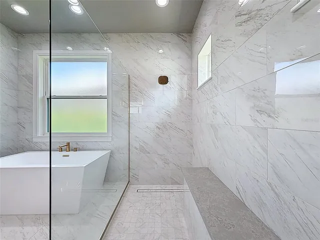 a front view of a house with a garden and yard