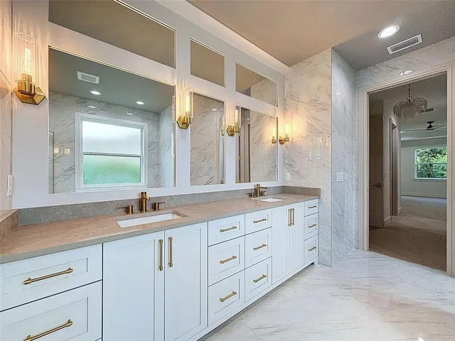 an aerial view of a house with a yard basket ball court and outdoor seating