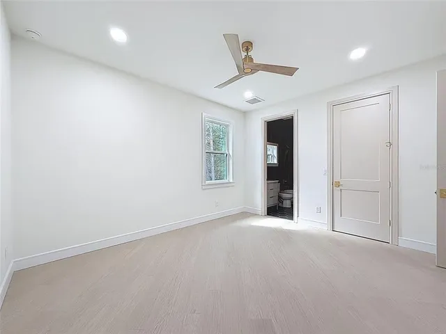 a view of a house with a yard and a garden