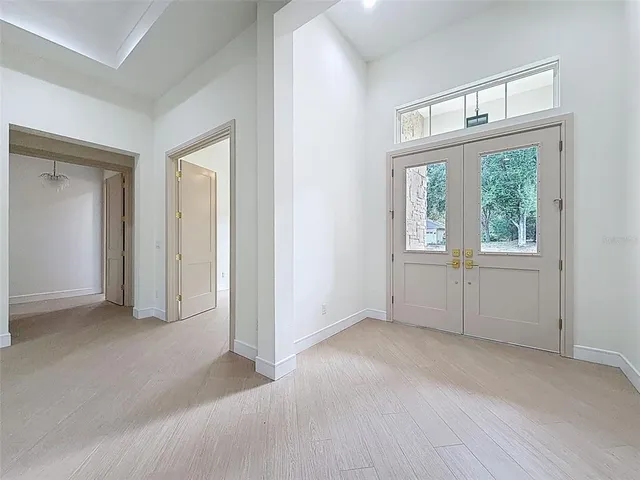 a kitchen with kitchen island granite countertop a stove and a sink