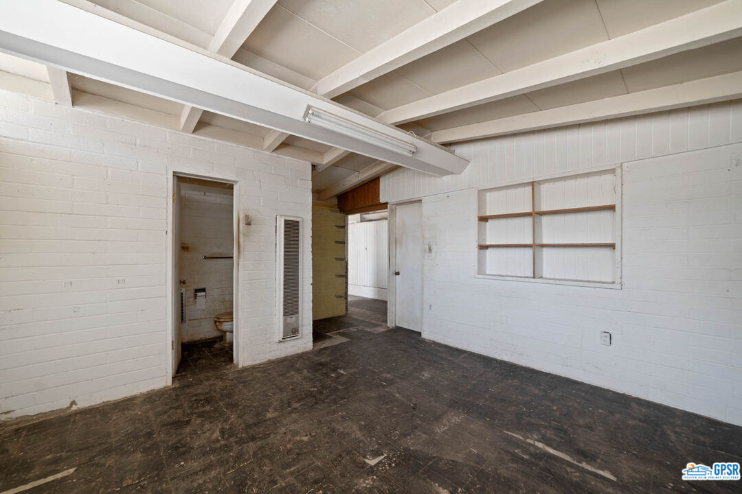 Undisclosed Address Palm Desert, CA 92260 - Photo 14 of 33 an empty room with windows