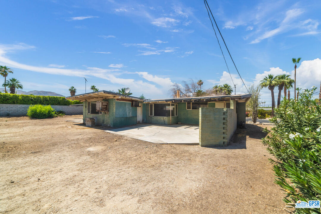 Undisclosed Address Palm Desert, CA 92260 - Photo 25 of 33 a view of a terrace with a garden