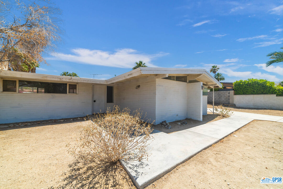 Undisclosed Address Palm Desert, CA 92260 - Photo 3 of 33 a backyard of a house with wooden fence