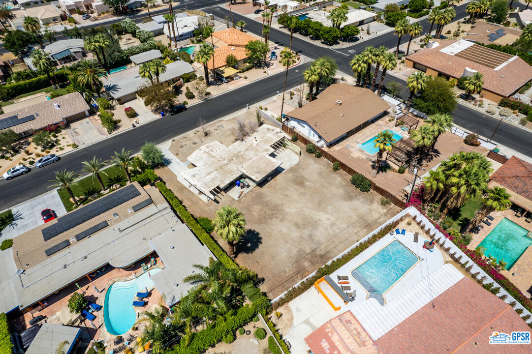 Undisclosed Address Palm Desert, CA 92260 - Photo 31 of 33 an aerial view of a house with a yard and pool