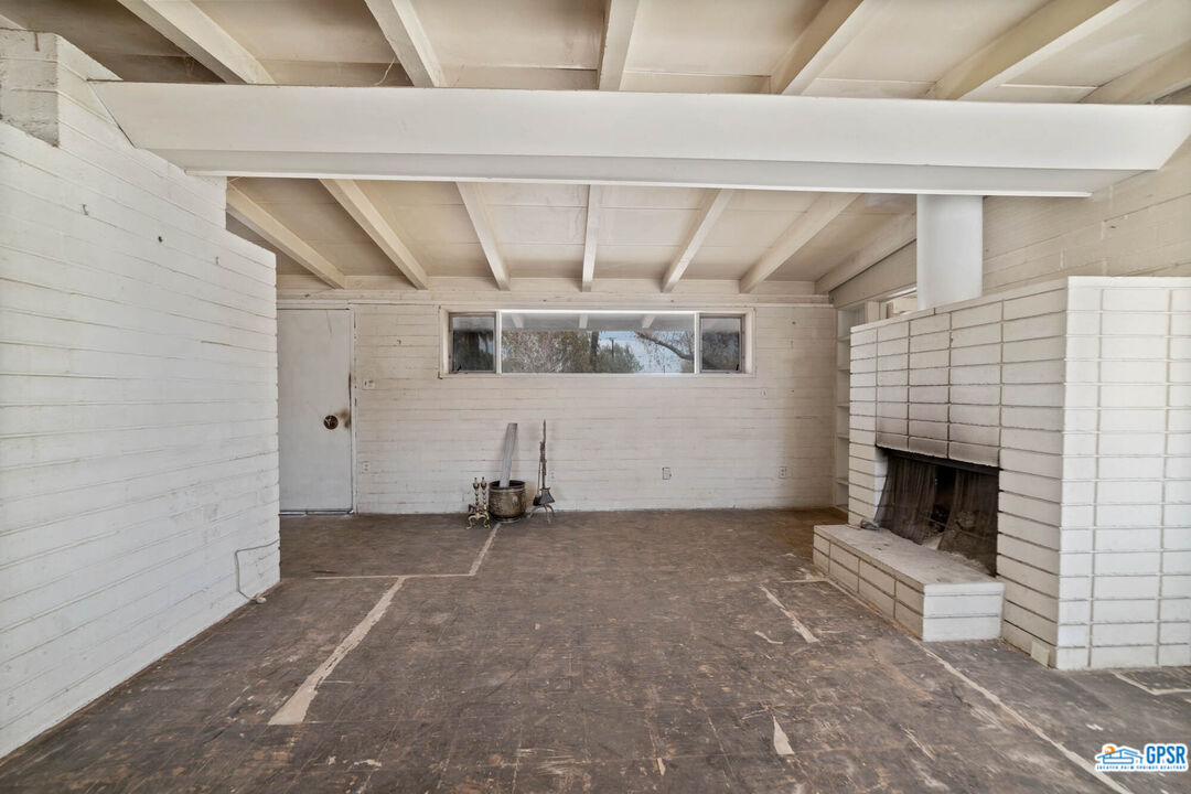 Undisclosed Address Palm Desert, CA 92260 - Photo 5 of 33 a view of empty room with fireplace