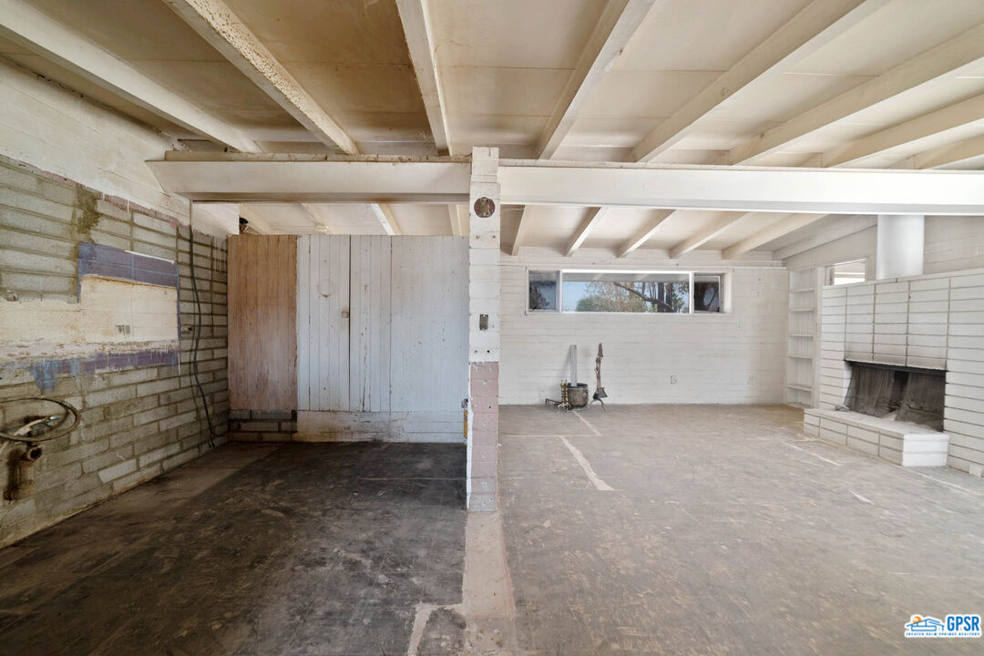 Undisclosed Address Palm Desert, CA 92260 - Photo 7 of 33 a view of a livingroom with a fireplace