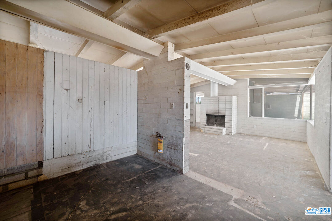 Undisclosed Address Palm Desert, CA 92260 - Photo 8 of 33 a view of a hallway with wooden shelves