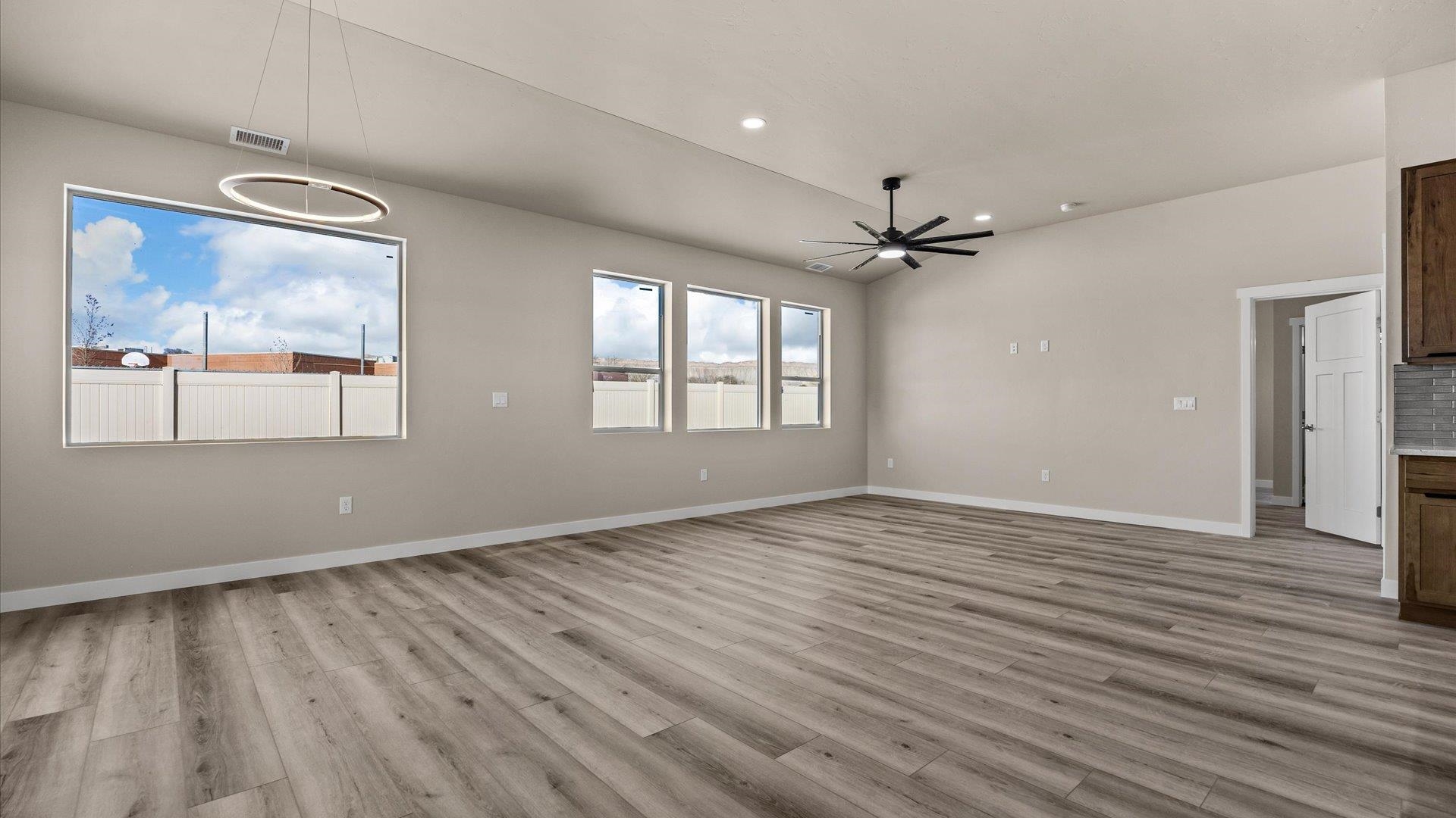 3066 Thunderhead Way Grand Junction, CO 81504 - Photo 11 of 30 a view of an empty room with a window and wooden floor