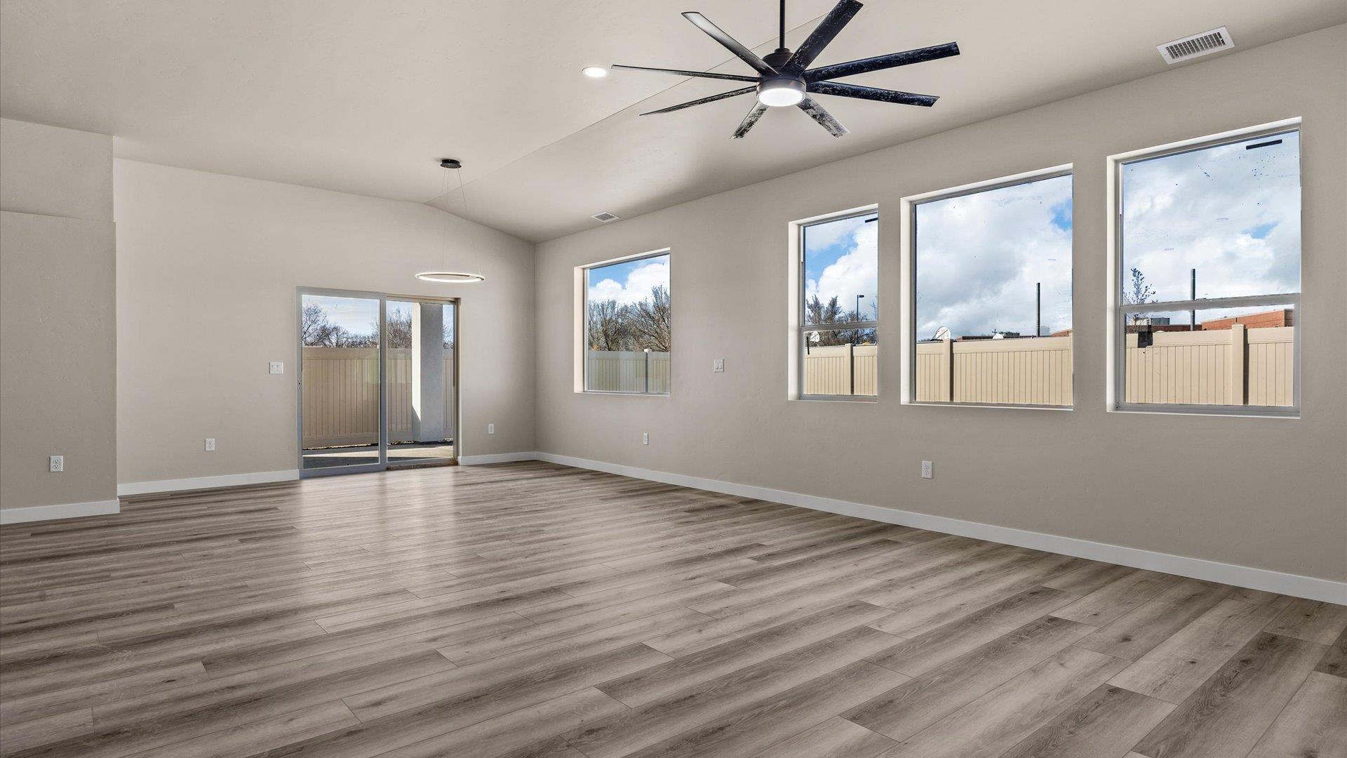 3066 Thunderhead Way Grand Junction, CO 81504 - Photo 12 of 30 a view of an empty room with a window and wooden floor