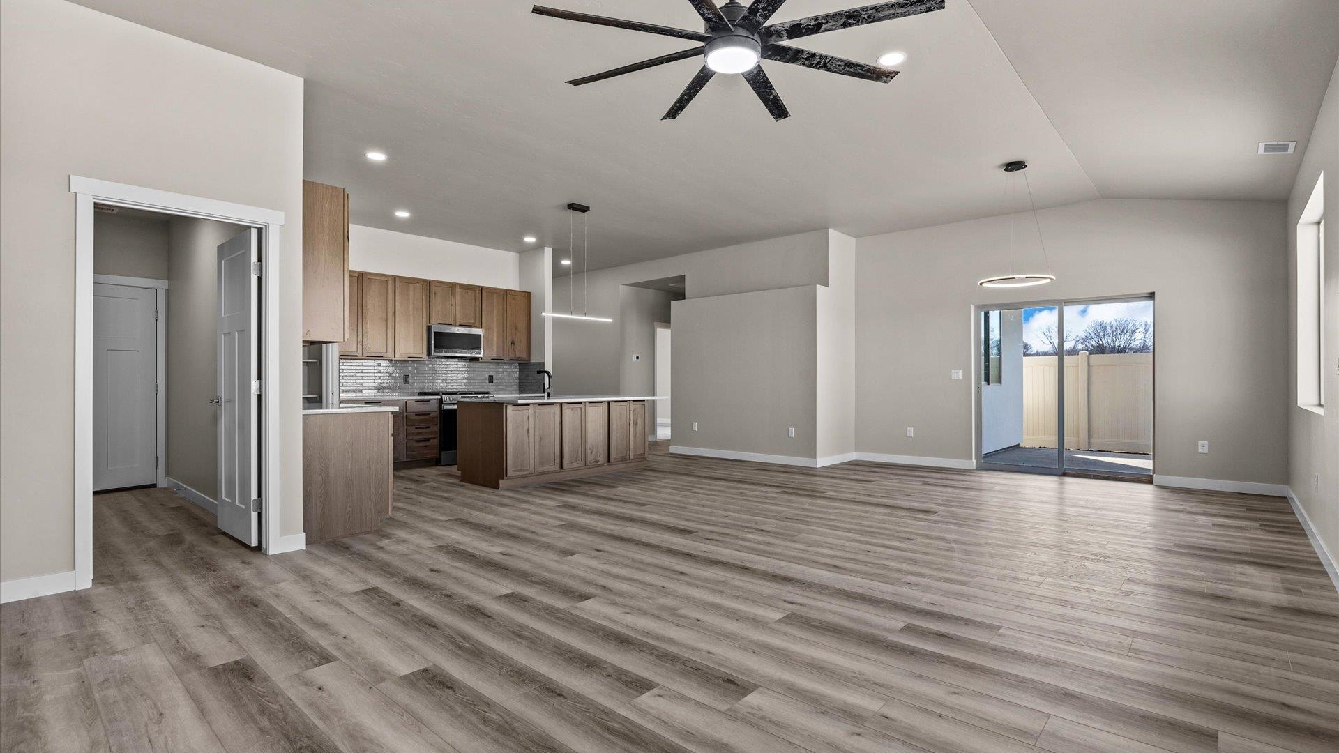 3066 Thunderhead Way Grand Junction, CO 81504 - Photo 13 of 30 a view of a kitchen with a sink and dishwasher a refrigerator with wooden floor