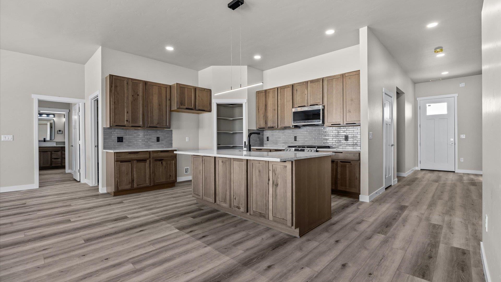 3066 Thunderhead Way Grand Junction, CO 81504 - Photo 15 of 30 a kitchen with stainless steel appliances a refrigerator sink and cabinets