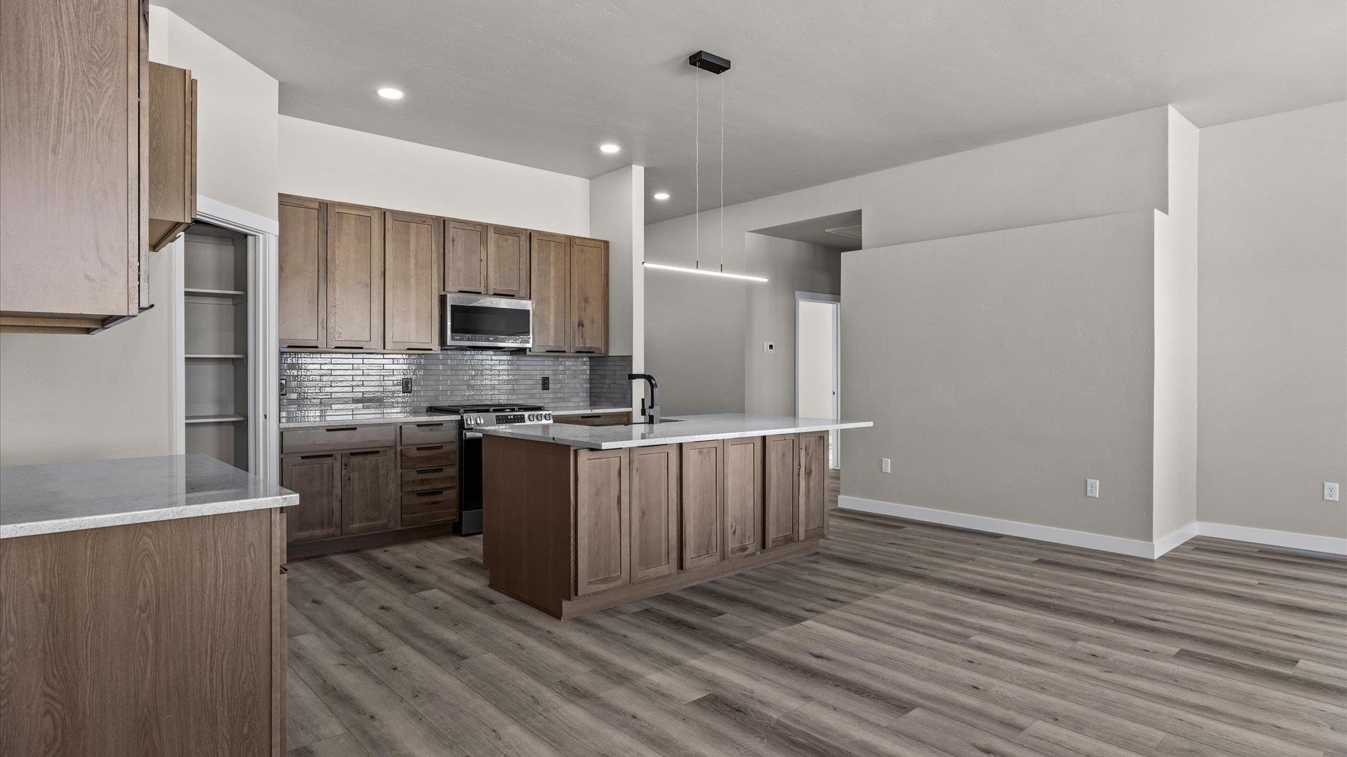 3066 Thunderhead Way Grand Junction, CO 81504 - Photo 17 of 30 a kitchen with a refrigerator sink and microwave