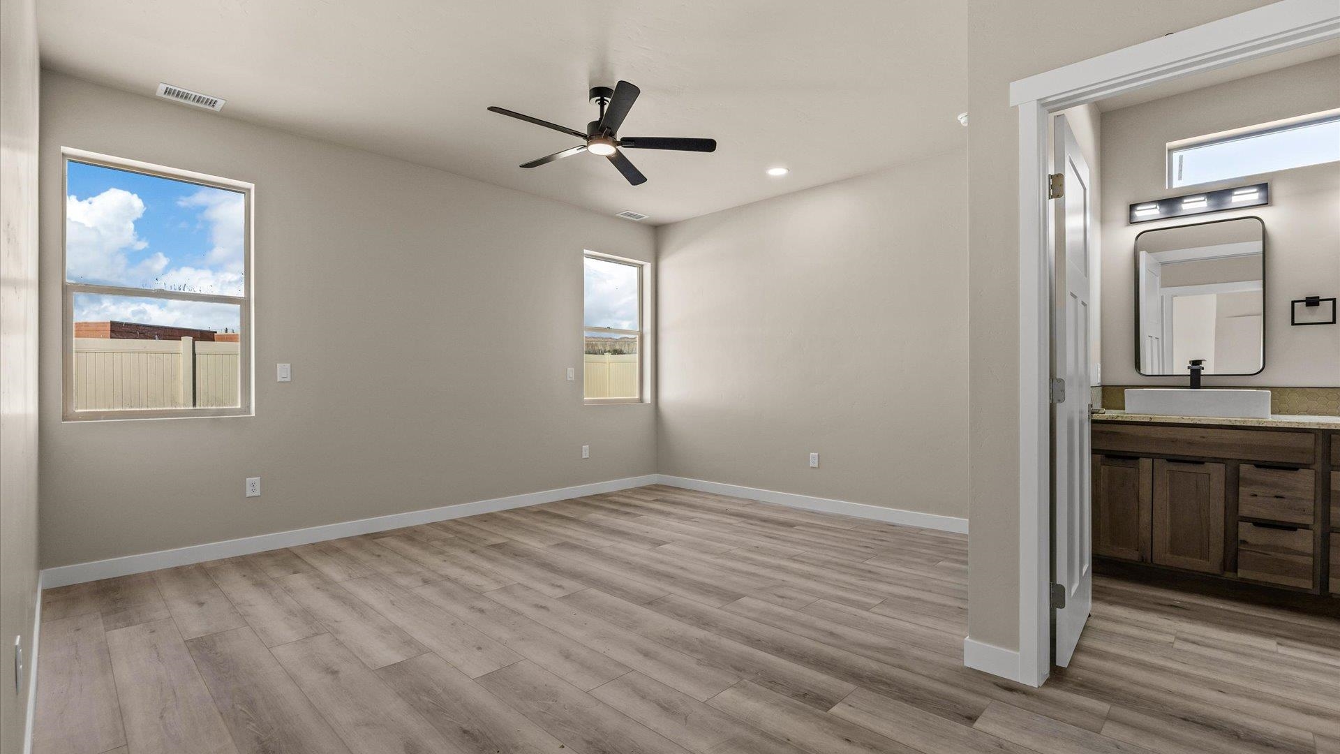 3066 Thunderhead Way Grand Junction, CO 81504 - Photo 18 of 30 a view of empty room with wooden floor and window