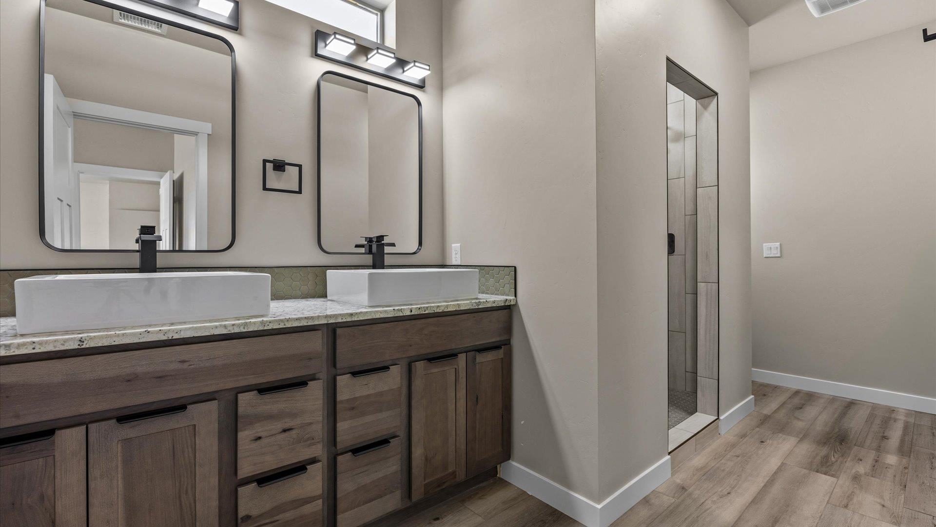 3066 Thunderhead Way Grand Junction, CO 81504 - Photo 20 of 30 a bathroom with a sink a mirror and a vanity