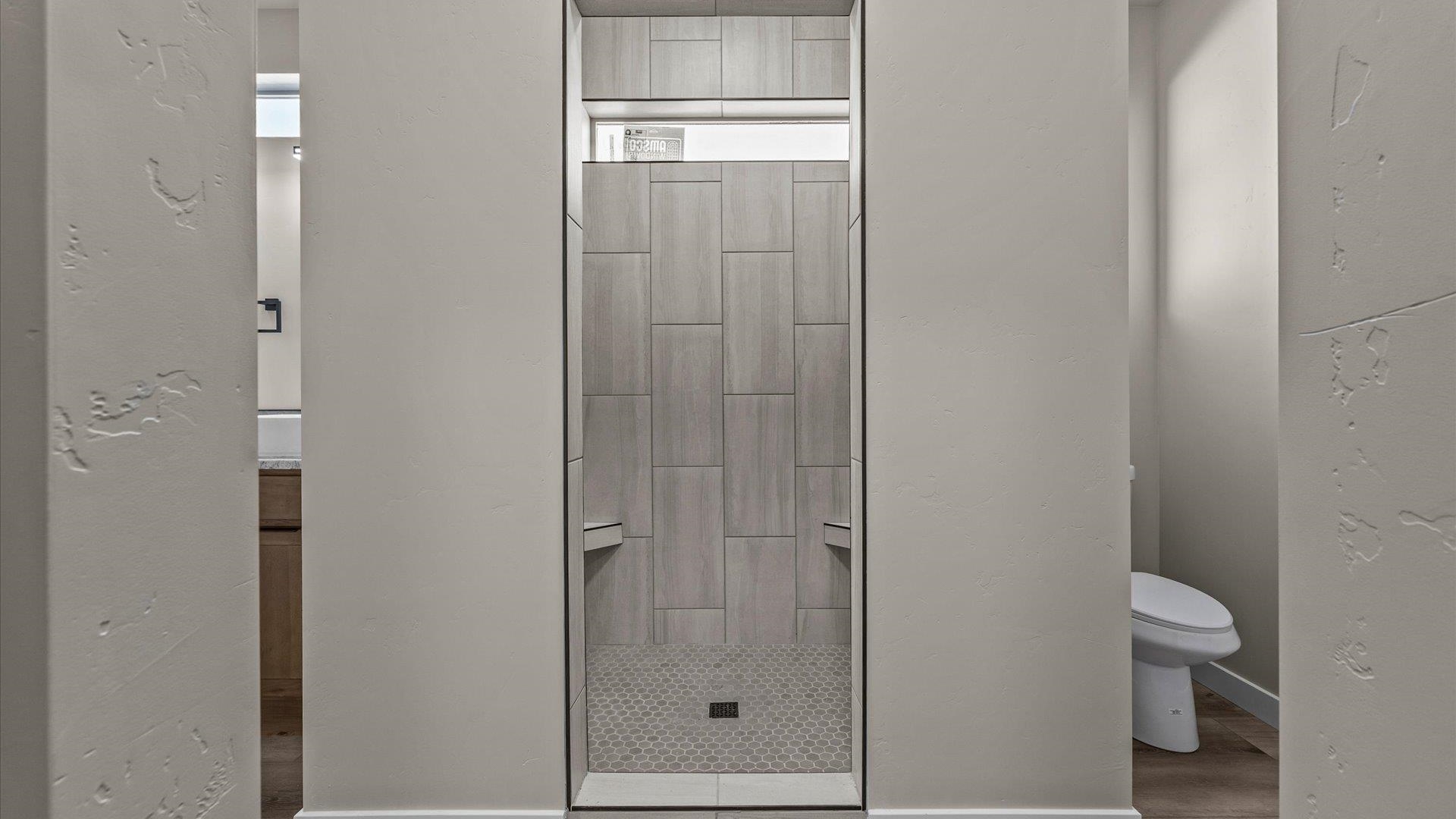 3066 Thunderhead Way Grand Junction, CO 81504 - Photo 22 of 30 a bathroom with a shower a toilet and a sink