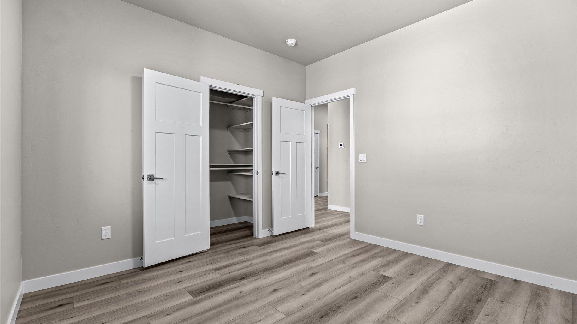 3066 Thunderhead Way Grand Junction, CO 81504 - Photo 25 of 30 a view of an empty room with wooden floor and closet