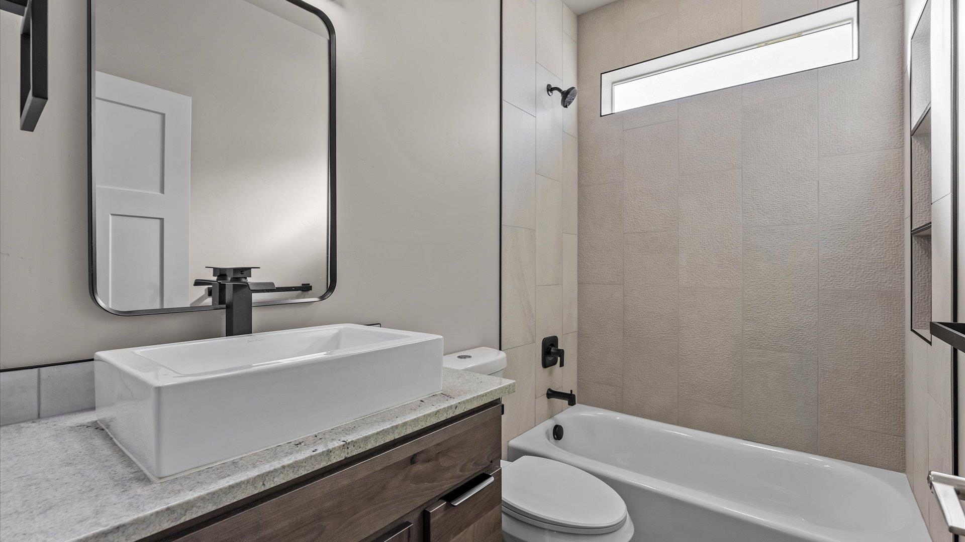 3066 Thunderhead Way Grand Junction, CO 81504 - Photo 26 of 30 a bathroom with a sink a toilet and shower
