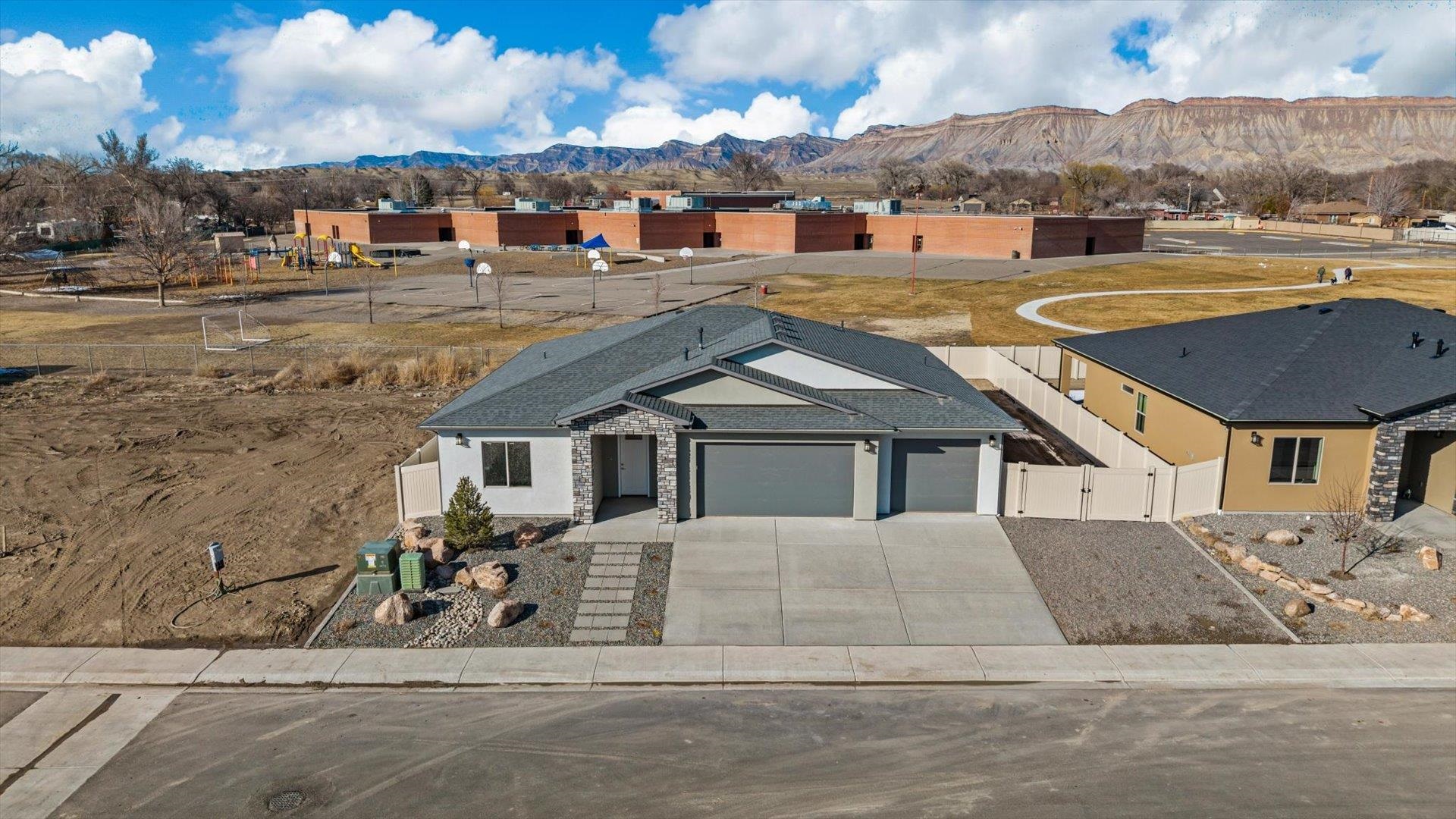 3066 Thunderhead Way Grand Junction, CO 81504 - Photo 4 of 30 a view of a house with a swimming pool