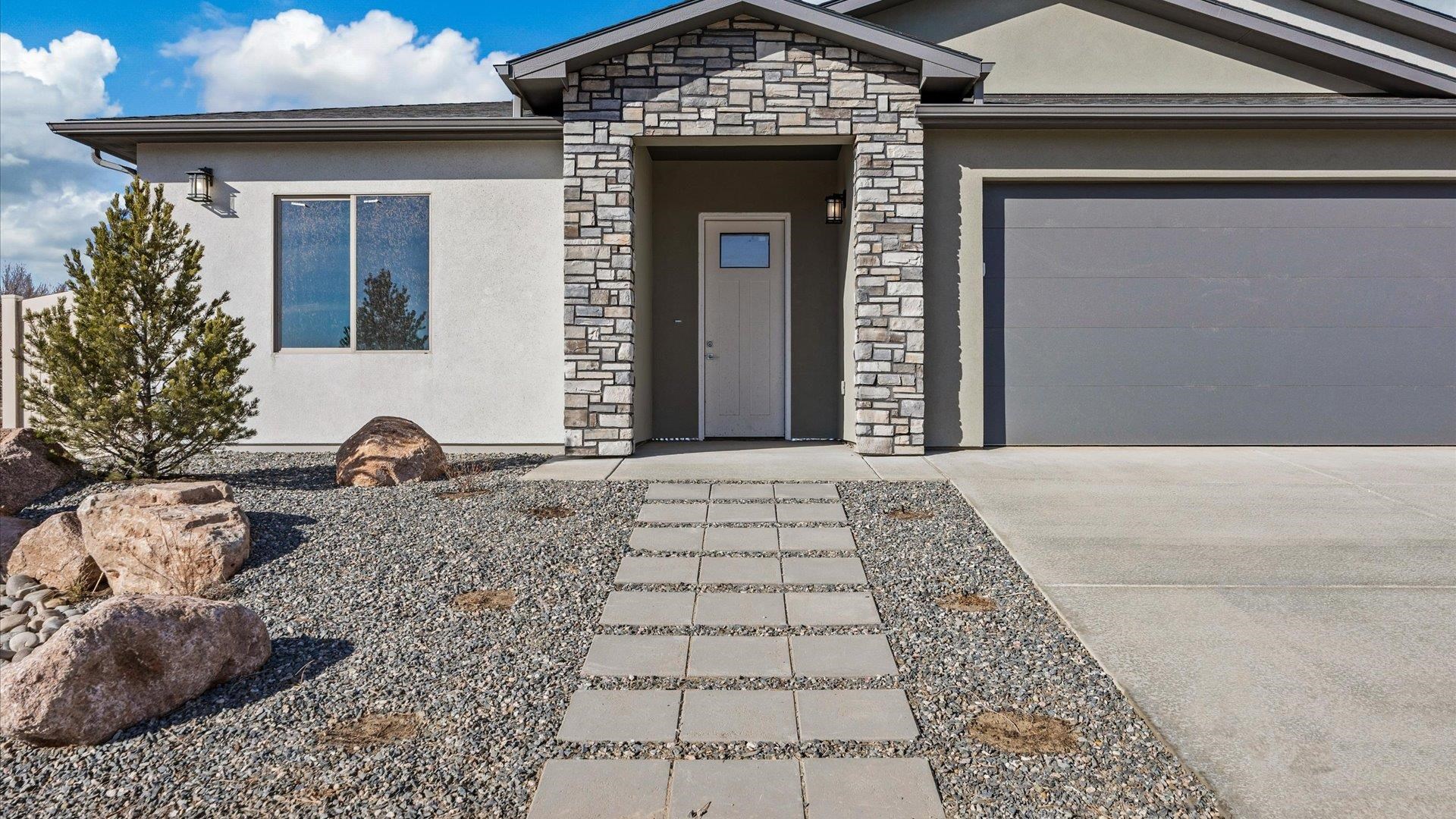 3066 Thunderhead Way Grand Junction, CO 81504 - Photo 8 of 30 a front view of a house