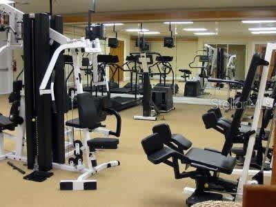 211 Caribbean Drive, Unit LOCKOUT Davenport, FL 33897 - Photo 11 of 14 a view of a room with gym equipment