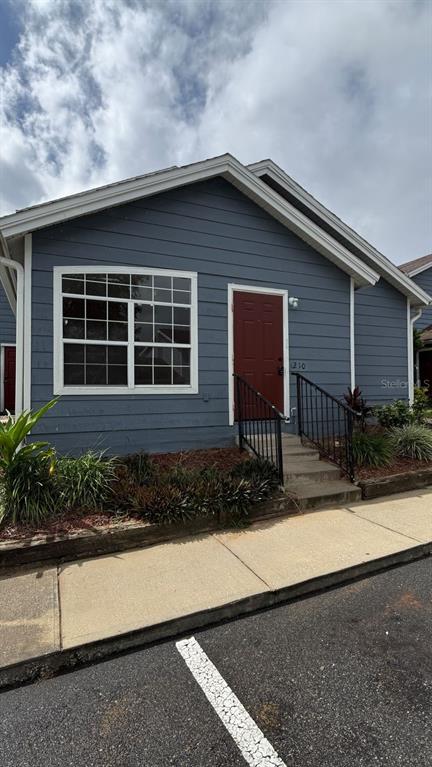 211 Caribbean Drive, Unit LOCKOUT Davenport, FL 33897 - Photo 2 of 14 a front view of a house with garden