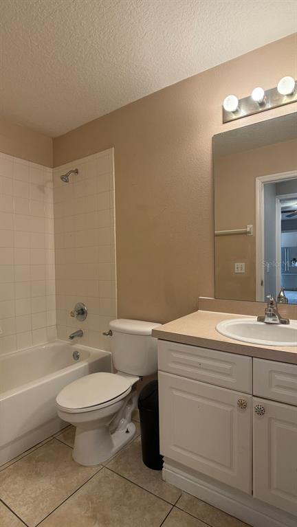 211 Caribbean Drive, Unit LOCKOUT Davenport, FL 33897 - Photo 8 of 14 a bathroom with a sink a toilet and shower