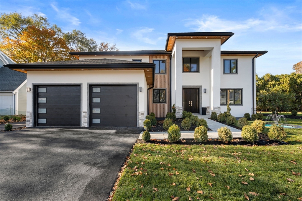 51 Pilgrim Road Needham, MA 02492 - Photo 1 of 42 a front view of a house with porch