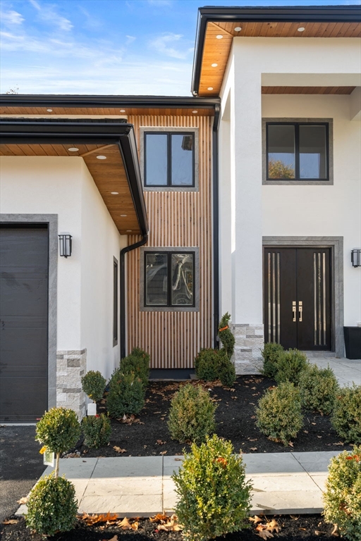 51 Pilgrim Road Needham, MA 02492 - Photo 2 of 42 a front view of a house with a yard